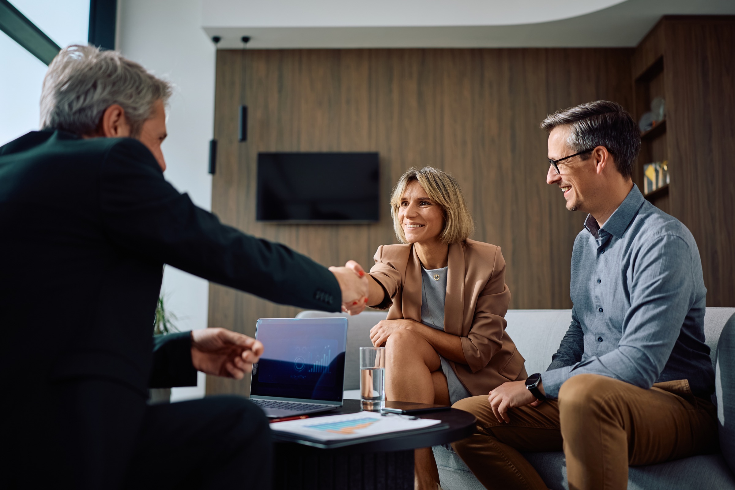 Business owner shaking hands with a finance adviser