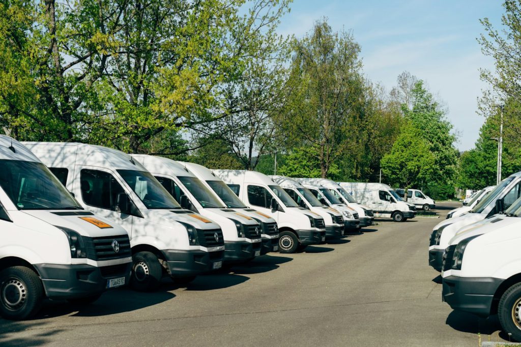 Rows of vehicles parked in a large lot