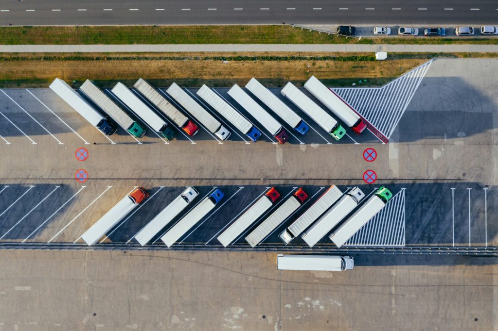 Aerial view of a fleet of lorries parked at a depot