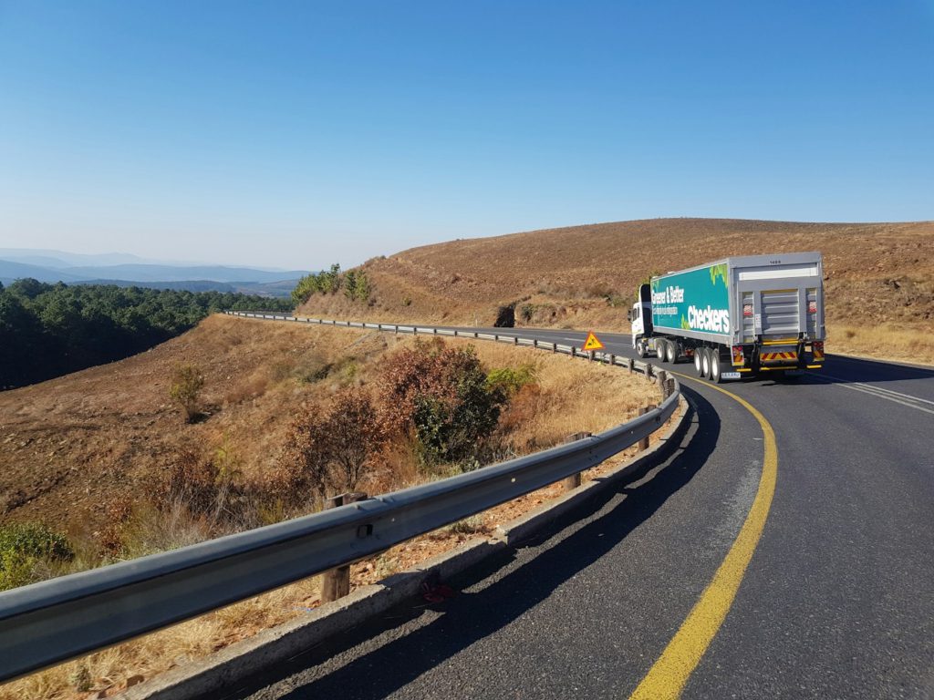 Articulated lorry on a winding country road