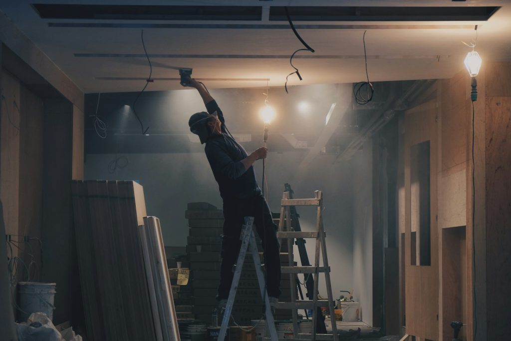Tradesperson refurbishing a commercial interior