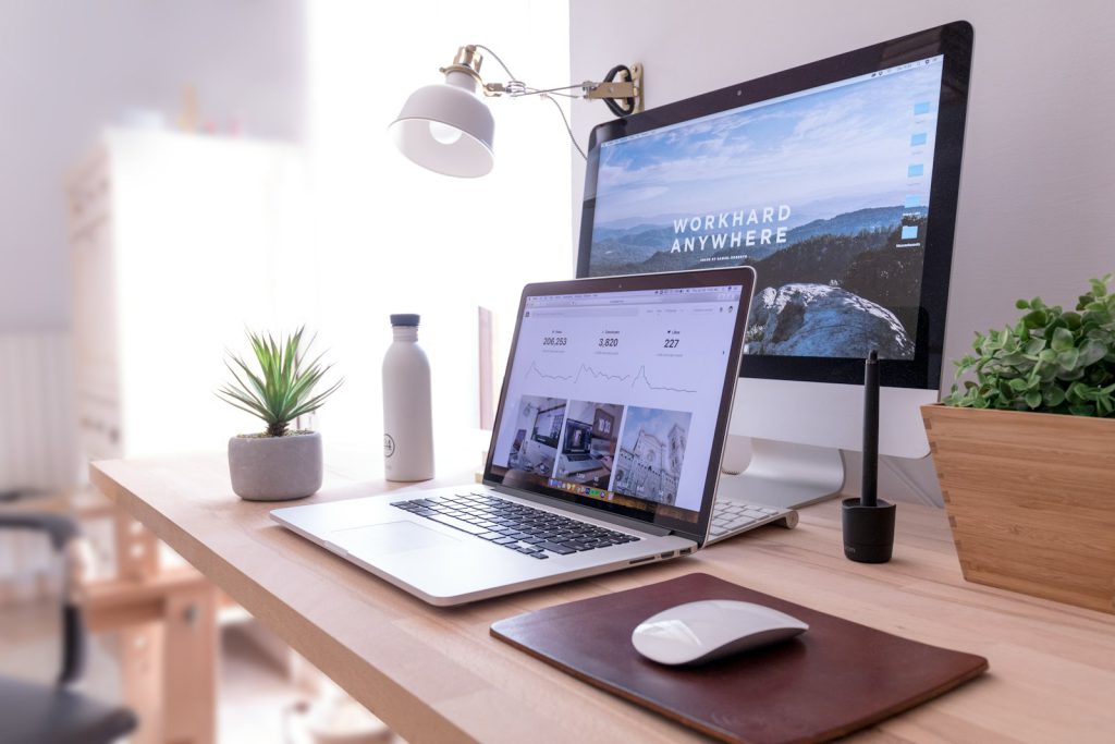Office desk with computers and technology