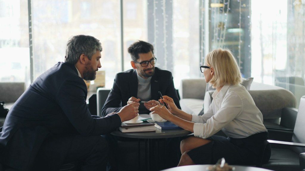 Business owners reviewing finance options in a meeting