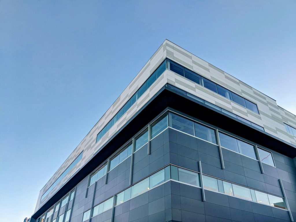 Modern commercial building against a blue sky